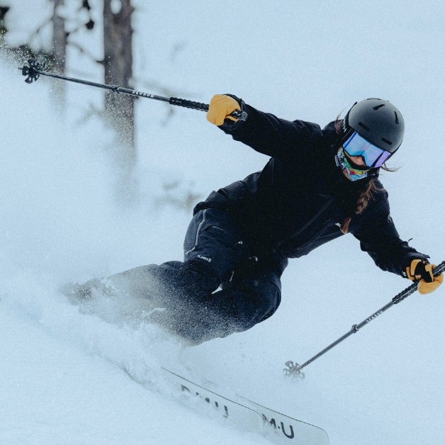 skier creating snow cloud