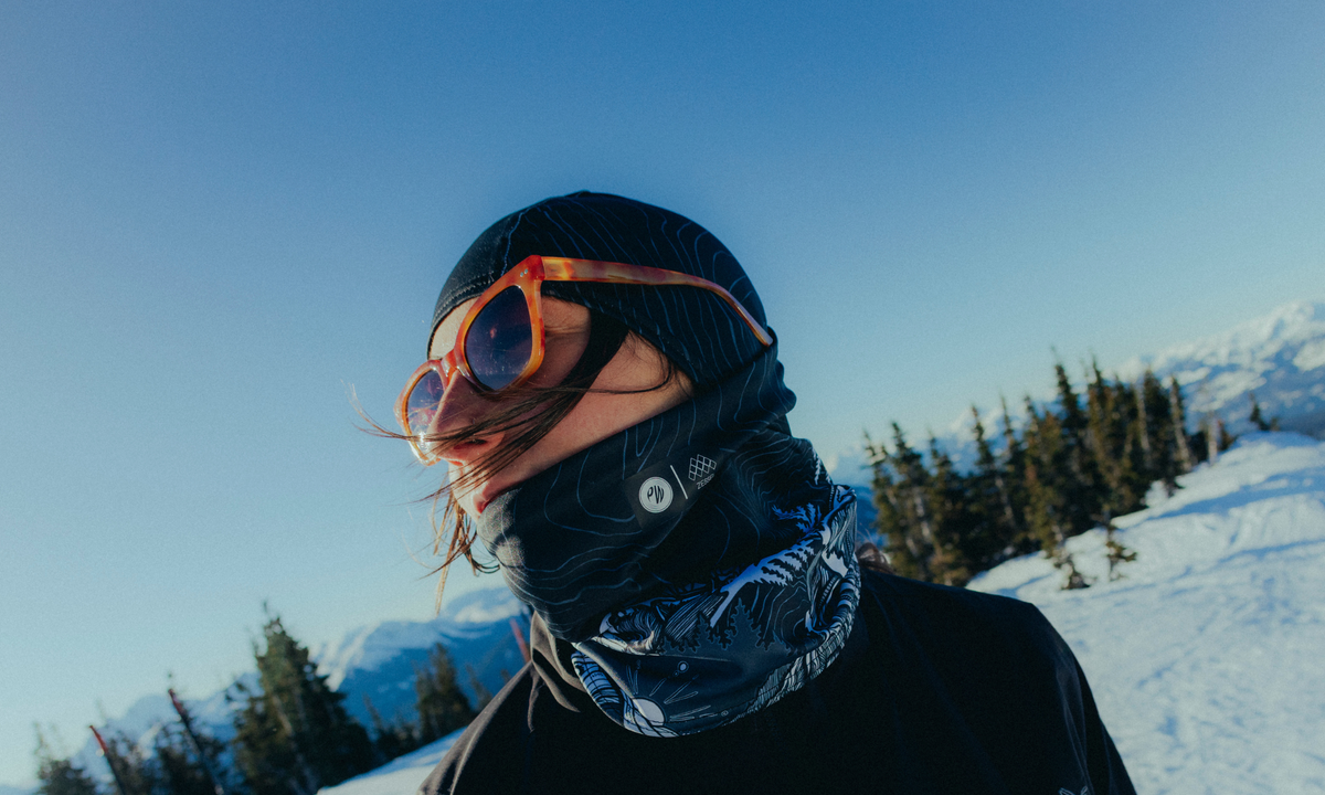 Girl wearing Kate Zessel Phunkshun Wear balaclava face covering for skiing in the mountains